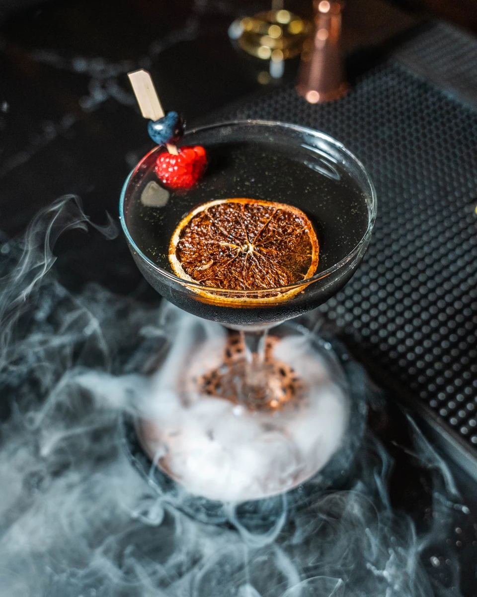 A smoky cocktail with dried citrus served at the Befikre bar