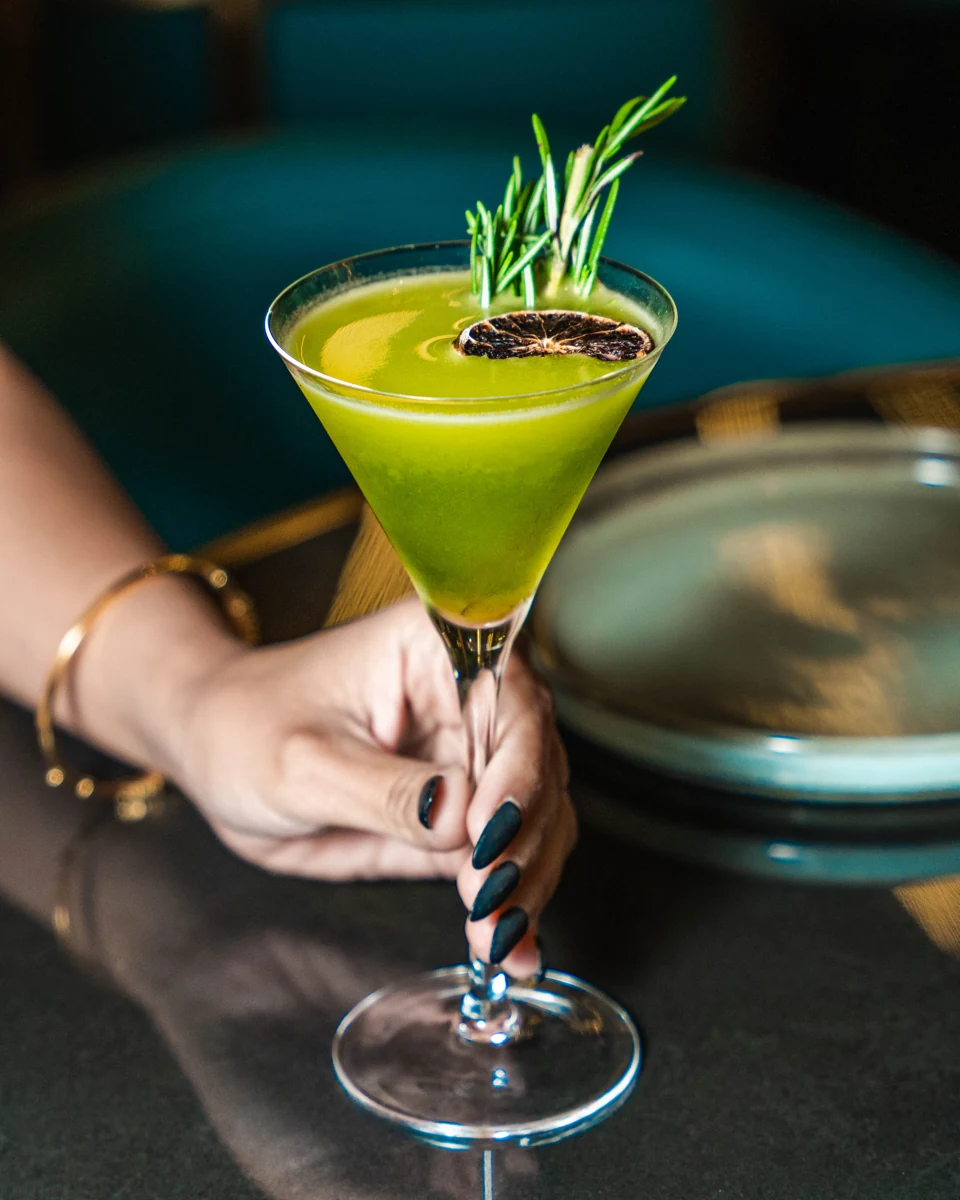A rosemary and citrus garnished cocktail served at Befikre