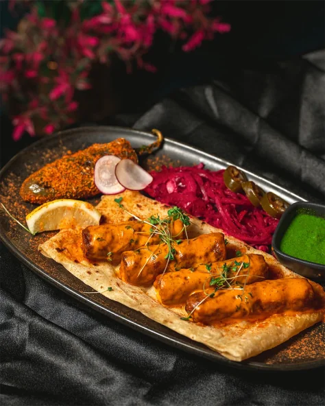 Paneer served on flatbread with pickled onions and chutney